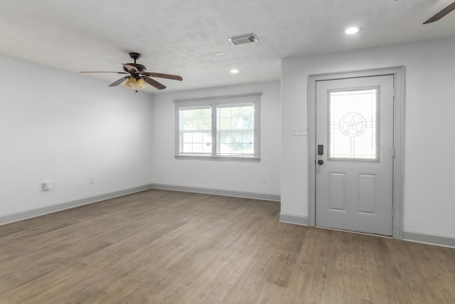 foyer entrance featuring recessed lighting, visible vents, a ceiling fan, wood finished floors, and baseboards