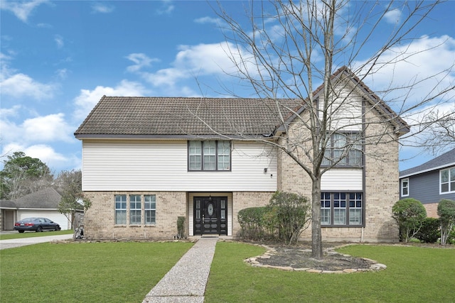 3610 Cypresswood Dr, Spring, TX 77388 - view of front of home featuring brick siding, a front yard, and a tiled roof