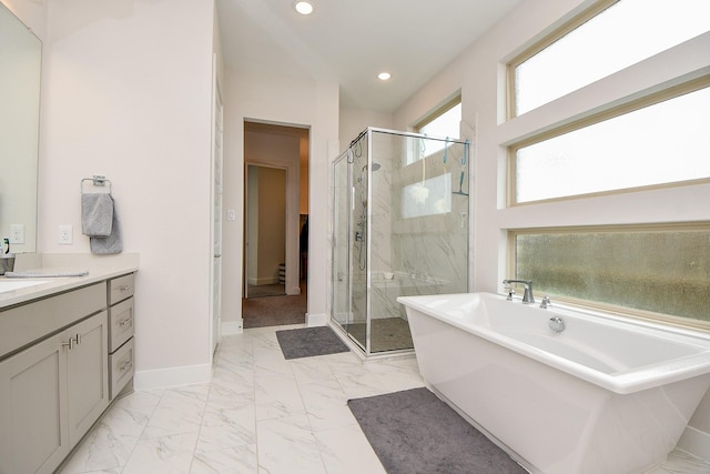 full bathroom featuring baseboards, marble finish floor, a stall shower, and recessed lighting