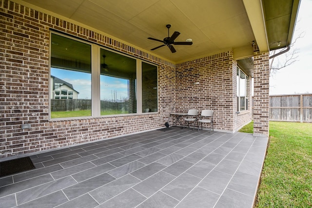 view of patio / terrace featuring a ceiling fan and fence