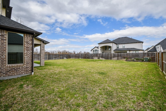 view of yard with a fenced backyard