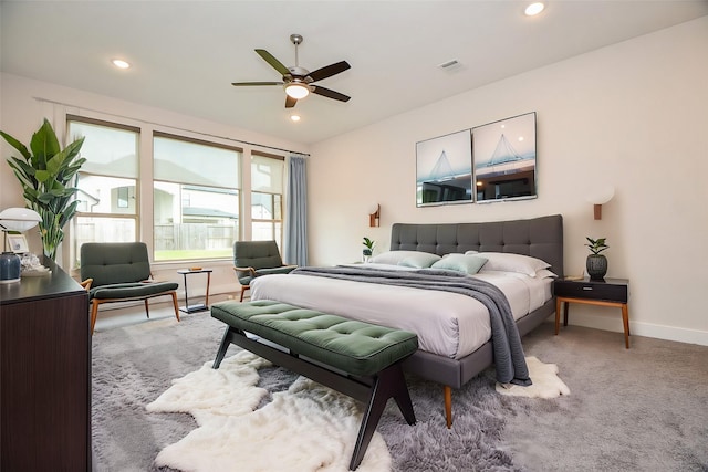 bedroom with light colored carpet, visible vents, baseboards, and recessed lighting