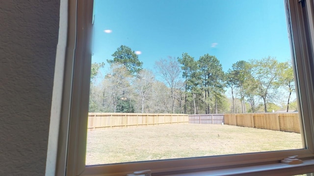 view of yard with a fenced backyard