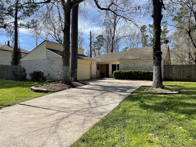 mid-century home with a front yard, brick siding, fence, and an attached garage