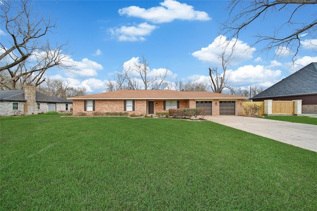 view of front of property with a garage, brick siding, concrete driveway, and a front lawn