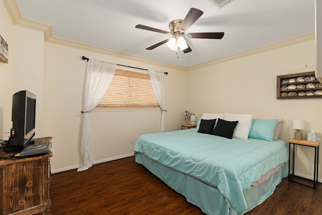 bedroom with ornamental molding, wood finished floors, a ceiling fan, and baseboards