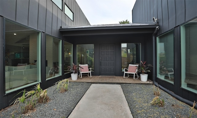 view of patio / terrace featuring a sunroom and a wooden deck