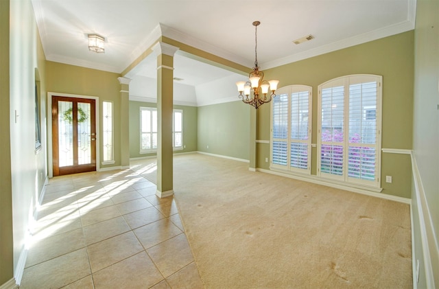 entrance foyer featuring visible vents, light carpet, light tile patterned flooring, and ornate columns