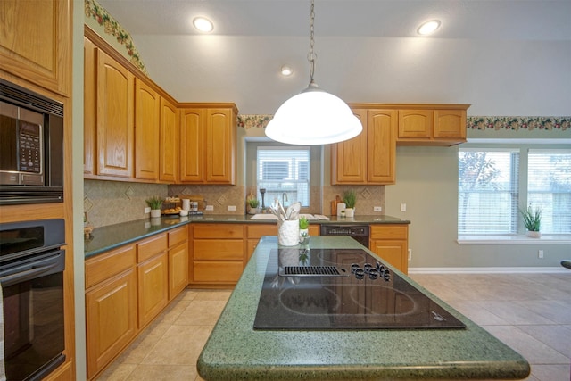 kitchen featuring backsplash, a center island, vaulted ceiling, light tile patterned floors, and black appliances