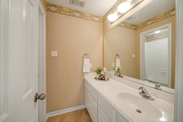 bathroom with visible vents, tile patterned flooring, baseboards, walk in shower, and vanity