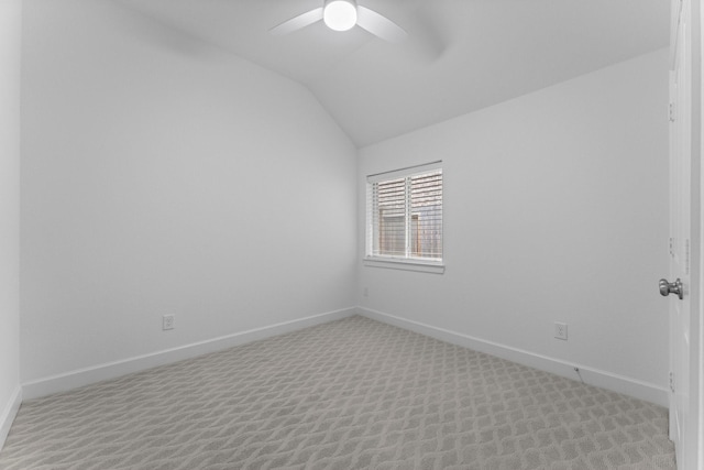 unfurnished room with lofted ceiling, ceiling fan, baseboards, and light colored carpet