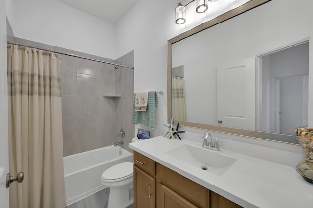 bathroom featuring toilet, shower / bath combination with curtain, and vanity