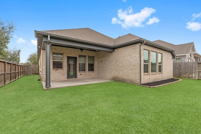 back of house featuring a patio, brick siding, and a fenced backyard