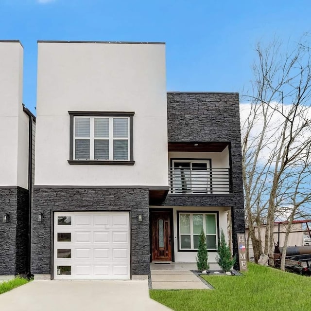 modern home with stone siding, a balcony, and stucco siding