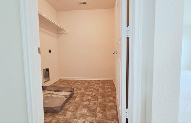 washroom with laundry area, visible vents, and electric dryer hookup