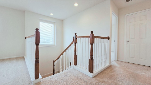 staircase with baseboards, carpet flooring, and recessed lighting