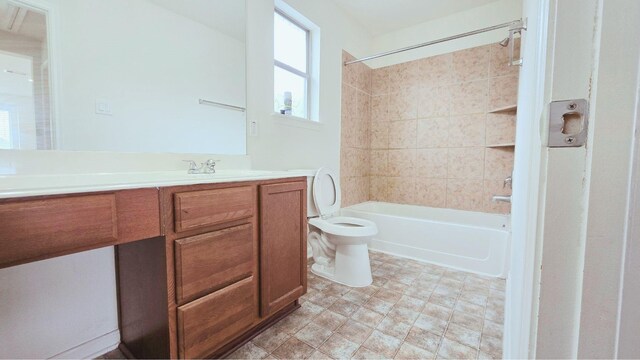 bathroom with vanity, toilet, and bathing tub / shower combination