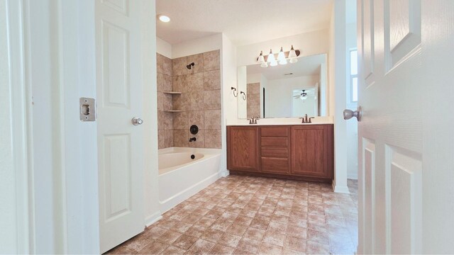 bathroom featuring shower / tub combination and vanity