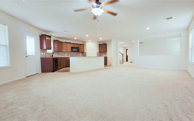 unfurnished living room featuring light carpet, baseboards, visible vents, and recessed lighting