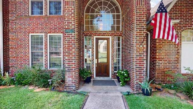 property entrance with brick siding