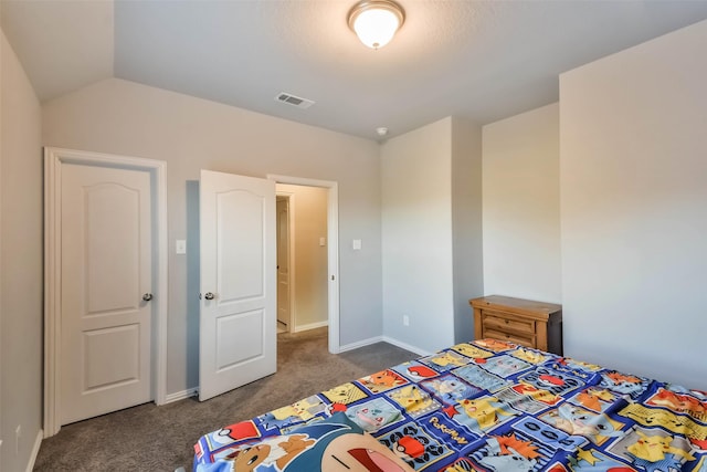 unfurnished bedroom featuring carpet, visible vents, vaulted ceiling, and baseboards