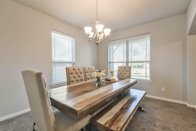 dining space featuring a notable chandelier, carpet flooring, and baseboards