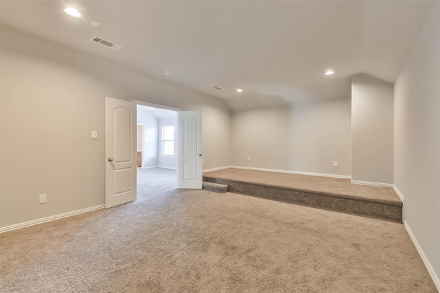 carpeted spare room with recessed lighting, visible vents, and baseboards