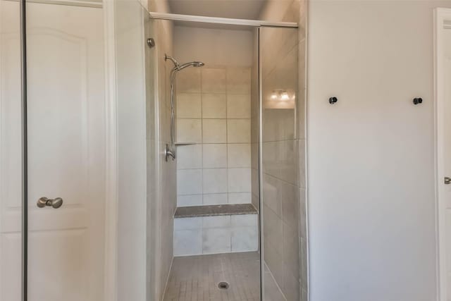 full bathroom featuring a shower stall