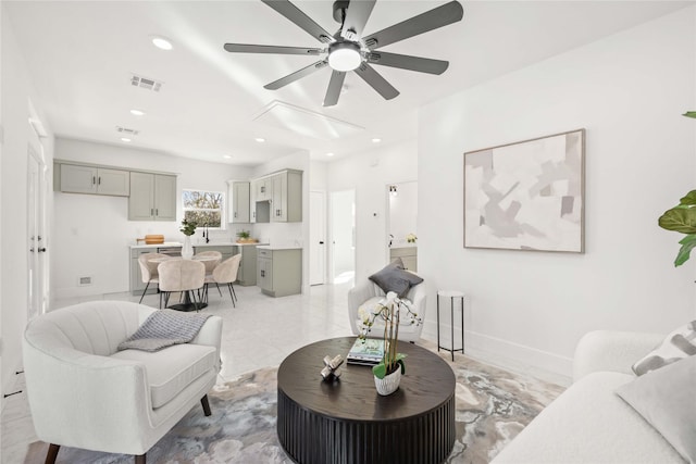 living room with baseboards, visible vents, a ceiling fan, and recessed lighting