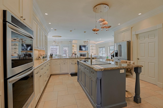 kitchen featuring stainless steel appliances, ornamental molding, a peninsula, and a kitchen bar