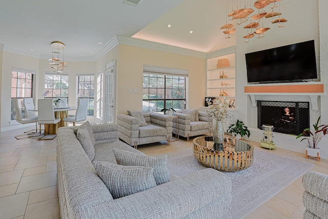 living area with a warm lit fireplace, built in shelves, plenty of natural light, and crown molding