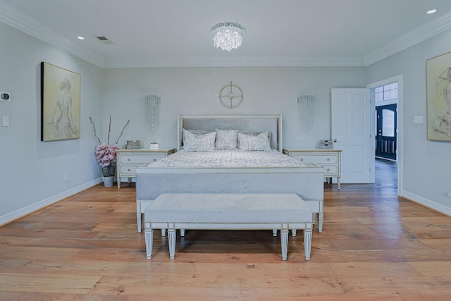 bedroom featuring crown molding, light wood-style flooring, and baseboards