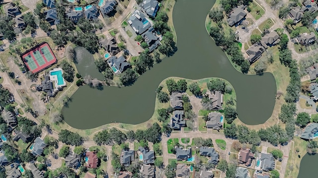 drone / aerial view with a water view and a residential view