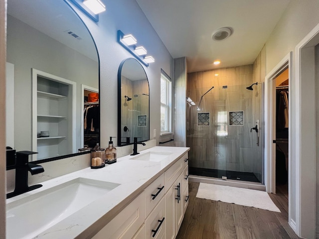 6804 Broadleaf Dr, Beaumont, TX 77708 - full bath featuring a walk in closet, a shower stall, and double vanity