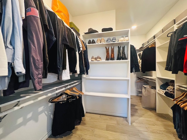 spacious closet featuring wood finish floors