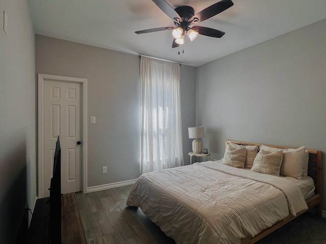 6804 Broadleaf Dr, Beaumont, TX 77708 - bedroom featuring dark wood-style flooring, baseboards, and ceiling fan