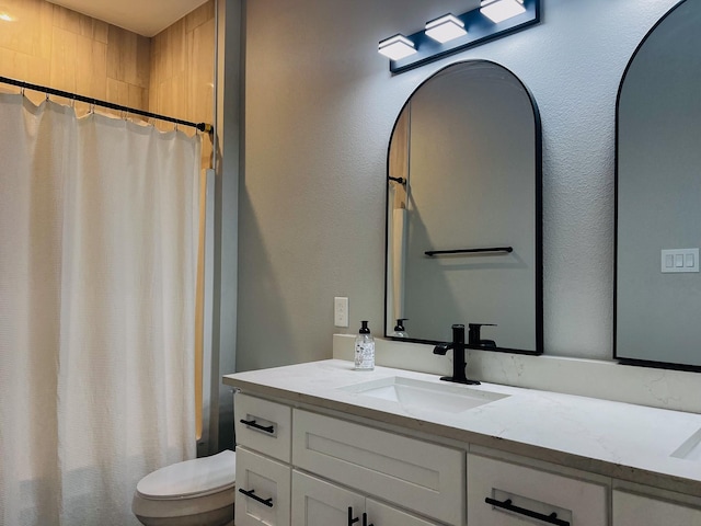 6804 Broadleaf Dr, Beaumont, TX 77708 - bathroom featuring vanity, toilet, and a shower with shower curtain