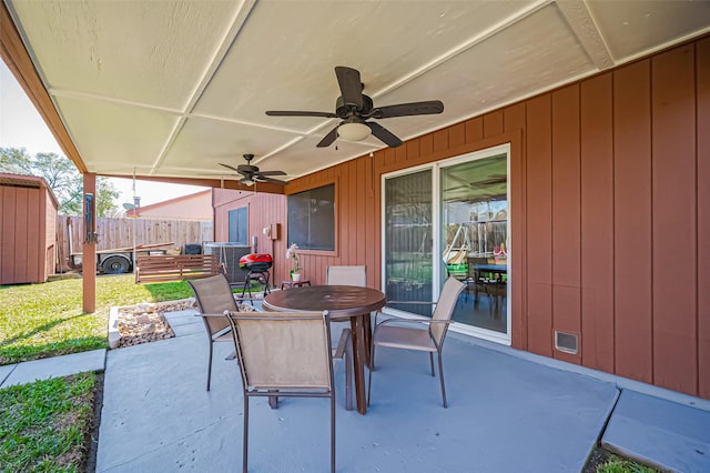 view of patio / terrace featuring outdoor dining area, visible vents, fence, and ceiling fan