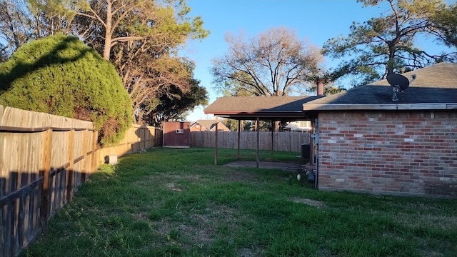 view of yard with a fenced backyard