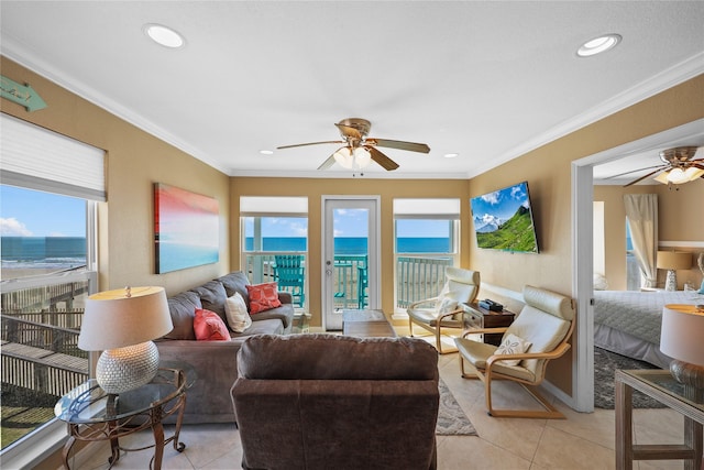 living area with light tile patterned floors, ornamental molding, a ceiling fan, and recessed lighting