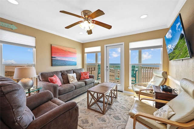 living room featuring ornamental molding and a healthy amount of sunlight