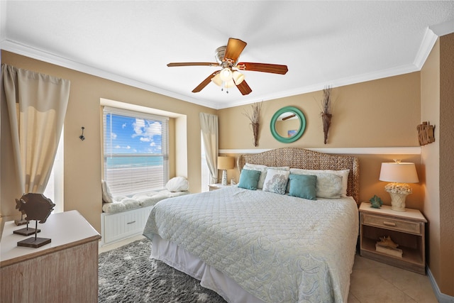 tiled bedroom featuring ceiling fan and crown molding