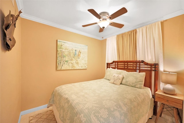 bedroom with baseboards, ceiling fan, and crown molding