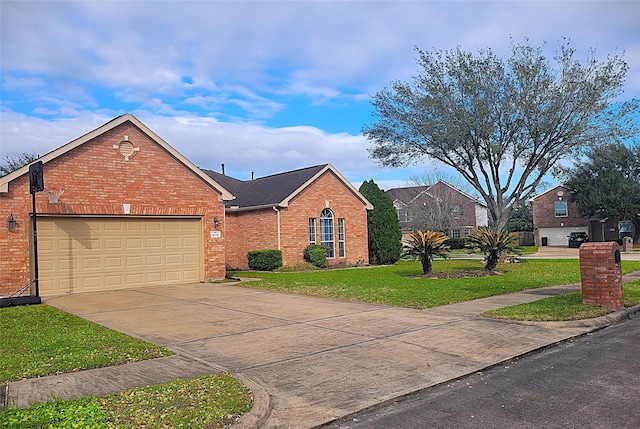 view of front of house featuring a garage, a front yard, brick siding, and driveway