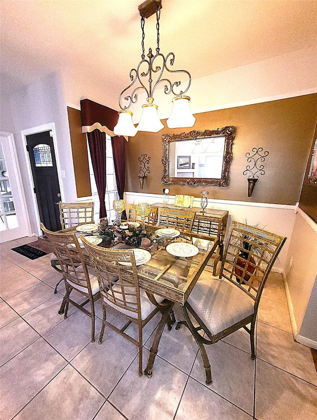 dining area featuring tile patterned flooring and baseboards