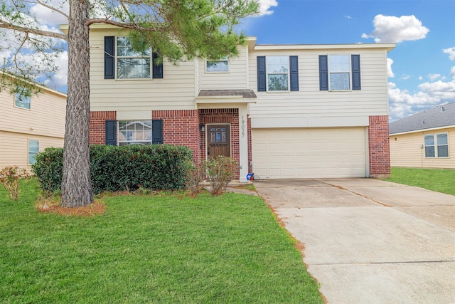 traditional-style house featuring an attached garage, driveway, brick siding, and a front yard