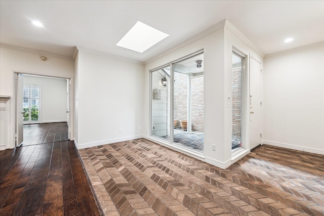 empty room with ornamental molding, a skylight, baseboards, and recessed lighting