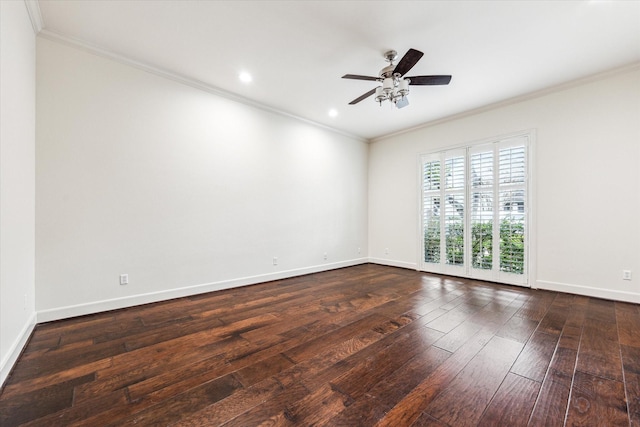 empty room featuring ornamental molding, a ceiling fan, hardwood / wood-style flooring, and baseboards