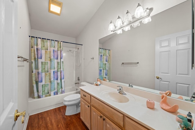 bathroom with toilet, shower / tub combo, wood finished floors, and vanity