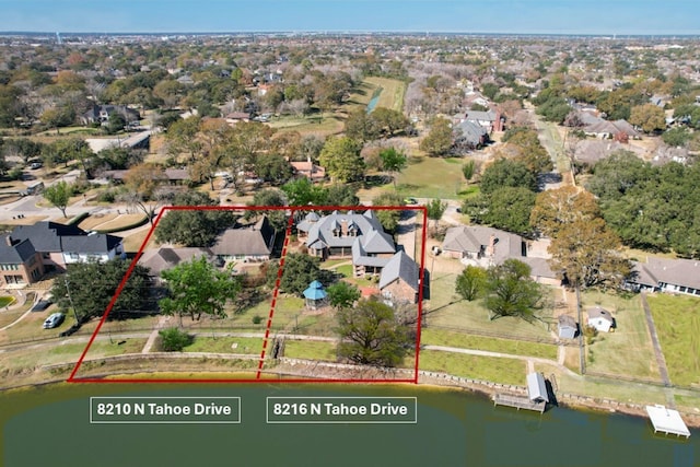 bird's eye view with a water view and a residential view